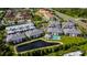 Aerial view of community featuring multiple buildings and a pond at 5707 N Honore Ave # 621, Sarasota, FL 34243
