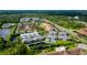 Aerial view of community with lake and pool at 5707 N Honore Ave # 621, Sarasota, FL 34243