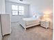 Charming bedroom with white furniture and a large window at 5707 N Honore Ave # 621, Sarasota, FL 34243