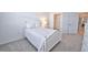 Cozy bedroom with a white bed frame and carpeted floors at 5707 N Honore Ave # 621, Sarasota, FL 34243