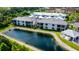 Aerial view of community with lake and pool at 5707 N Honore Ave # 621, Sarasota, FL 34243