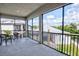 Screened balcony overlooking a lake and nature at 5707 N Honore Ave # 621, Sarasota, FL 34243