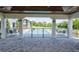 Community pool with covered seating area at 5707 N Honore Ave # 621, Sarasota, FL 34243
