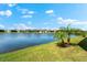 Scenic backyard overlooking a serene lake, enhancing the peaceful atmosphere of the property at 12918 Rainwashed Loop, Parrish, FL 34219