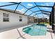 Screened-in pool with jacuzzi, and covered patio at 12918 Rainwashed Loop, Parrish, FL 34219