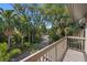 Balcony with view of tropical landscaping and walkway at 1485 Landings Lake Dr # 36, Sarasota, FL 34231