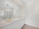 Bright bathroom with double vanity and large mirror at 596 Yawl Ln, Longboat Key, FL 34228