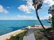 Walk along the paved path to enjoy scenic water views at 596 Yawl Ln, Longboat Key, FL 34228