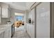 White kitchen features stainless steel appliances and ample cabinet space at 3080 Grand Bay Blvd # 532, Longboat Key, FL 34228