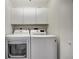 Laundry room with washer and dryer, cabinets at 3080 Grand Bay Blvd # 532, Longboat Key, FL 34228