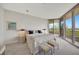 Main bedroom features a king bed and calming decor at 3080 Grand Bay Blvd # 532, Longboat Key, FL 34228