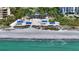 Aerial view of beach, club house, and ocean at 3080 Grand Bay Blvd # 532, Longboat Key, FL 34228