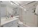 Clean bathroom with shower, toilet and vanity at 3080 Grand Bay Blvd # 532, Longboat Key, FL 34228