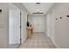 Bright and airy entryway with tile floors and modern console table at 3080 Grand Bay Blvd # 532, Longboat Key, FL 34228