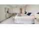 Main bedroom with king bed, dresser, and desk area at 3080 Grand Bay Blvd # 532, Longboat Key, FL 34228