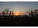 Stunning sunset view over the neighborhood and waterways at 3080 Grand Bay Blvd # 532, Longboat Key, FL 34228
