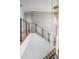 Modern staircase with glass railings and light wood flooring at 214 S Renellie Dr, Tampa, FL 33609