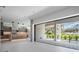 Open living space with floor-to-ceiling windows and fireplace at 214 S Renellie Dr, Tampa, FL 33609