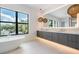 Modern bathroom with a large window and double vanity at 214 S Renellie Dr, Tampa, FL 33609