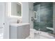 Contemporary bathroom with a sleek vanity and frameless shower at 214 S Renellie Dr, Tampa, FL 33609