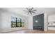 Bright bedroom featuring a modern fireplace and large window at 214 S Renellie Dr, Tampa, FL 33609