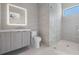 Modern bathroom with gray tile, floating vanity, and glass shower at 214 S Renellie Dr, Tampa, FL 33609