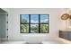 Bathroom with a freestanding tub and large window at 214 S Renellie Dr, Tampa, FL 33609