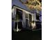 Modern home with stylish architectural details and landscape lighting at 214 S Renellie Dr, Tampa, FL 33609