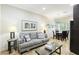 Living room features sofa, coffee table, and dining area at 1020 Sun N Sea Dr # 102, Sarasota, FL 34242