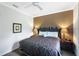King-size bed, ceiling fan, and large window in bedroom at 1020 Sun N Sea Dr # 102, Sarasota, FL 34242