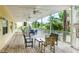 Outdoor patio area with seating and ceiling fans at 1020 Sun N Sea Dr # 102, Sarasota, FL 34242