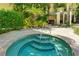 Community hot tub with surrounding patio at 1020 Sun N Sea Dr # 102, Sarasota, FL 34242