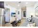Open living space with sofa, coffee table, and access to other rooms at 1020 Sun N Sea Dr # 102, Sarasota, FL 34242