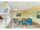 Shared patio with wooden deck, seating, and ceiling fan at 1020 Sun N Sea Dr # 102, Sarasota, FL 34242