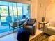 Living room with access to a private balcony at 8630 Midnight Pass Rd # 103A, Sarasota, FL 34242