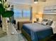 Bedroom with a double bed, dresser, and window at 8630 Midnight Pass Rd # 103A, Sarasota, FL 34242