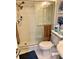 Clean bathroom with shower, toilet and sink at 8630 Midnight Pass Rd # 103A, Sarasota, FL 34242