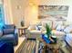 Comfortable living room with sectional sofa and coastal decor at 8630 Midnight Pass Rd # 103A, Sarasota, FL 34242