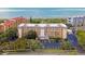 Oceanfront condo building with parking and lush landscaping at 8630 Midnight Pass Rd # 103A, Sarasota, FL 34242