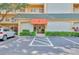 Condo building entrance with parking at 8630 Midnight Pass Rd # 103A, Sarasota, FL 34242