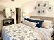 Main bedroom with king-size bed and coastal decor at 8630 Midnight Pass Rd # 103A, Sarasota, FL 34242