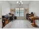 Bright and spacious home office with wood flooring and large window at 4952 Surfside Cir, Bradenton, FL 34211