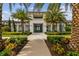 Community clubhouse with palm trees and landscaping at 4952 Surfside Cir, Bradenton, FL 34211