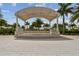 Covered outdoor stage area with string lights at 4952 Surfside Cir, Bradenton, FL 34211