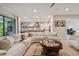 Open living space with white sectional and kitchen views at 4952 Surfside Cir, Bradenton, FL 34211