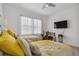 Bedroom with two twin beds, exercise bike, and TV at 4952 Surfside Cir, Bradenton, FL 34211