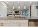 Kitchen island with sink, granite countertop and seating at 4952 Surfside Cir, Bradenton, FL 34211