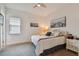 Comfortable bedroom with a queen bed, coastal decor, and ceiling fan at 4952 Surfside Cir, Bradenton, FL 34211