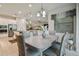Bright dining room adjacent to the kitchen, featuring a large table and chairs at 4952 Surfside Cir, Bradenton, FL 34211