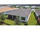 Rear view of house showcasing screened patio and lawn at 4952 Surfside Cir, Bradenton, FL 34211